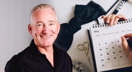 Man's headshot in front of yearly calendar stock photo