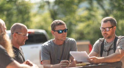 Builders reviewing documents