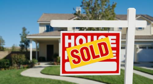 Home for sale sign with 'Sold' on top