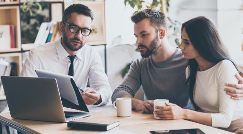 Homebuyers in finance meeting