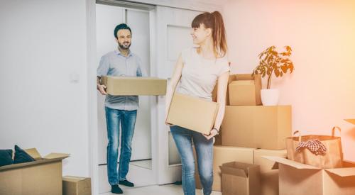 Young couple with moving boxes