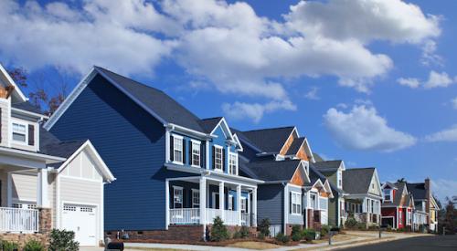 House-lined suburban street on sunny day