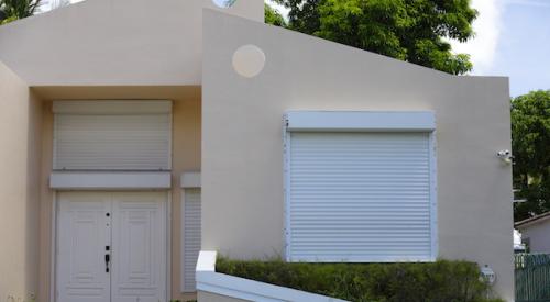 Home with hurricane shutters on window