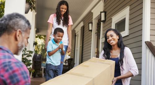 Family moving into suburban home