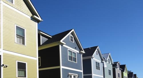 Several houses line a street.