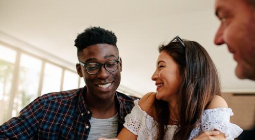 Two homebuyers smiling