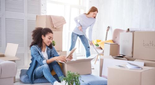 Two girls moving into apartment