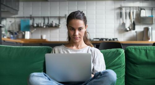 woman looking at laptop