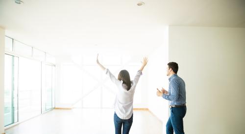 Happy couple moving in