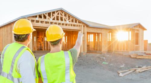 Two builders at construction site