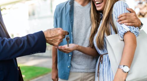 New homeowners receiving keys