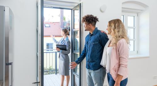 Couple touring a home for sale