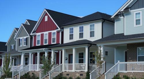 Row of homes with front steps leading down to the street