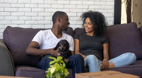 Smiling couple in new home