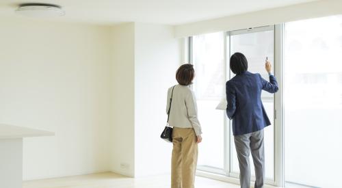 woman touring home with broker