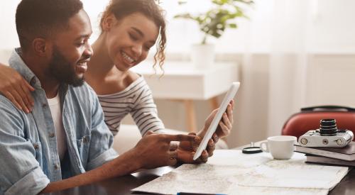 couple smiling, home searching online