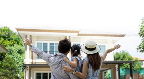 family looking at house