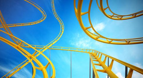 Yellow rollercoaster with blue sky in background