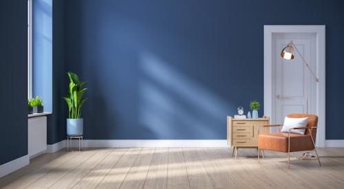 Living room walls painted blue, with a white door