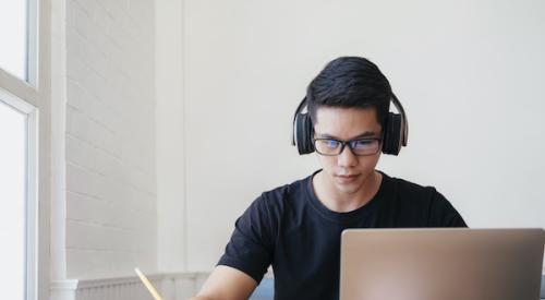 Teenager working on a laptop