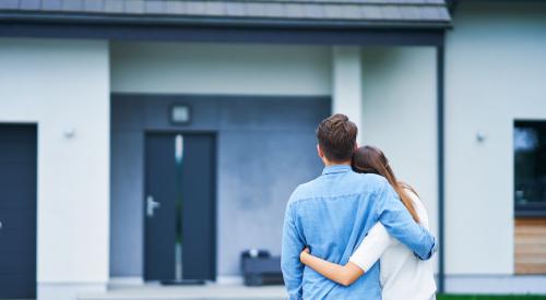 Couple looking at house