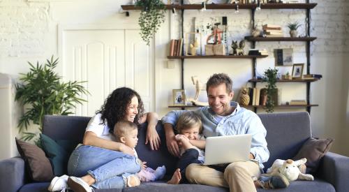 Family sitting on couch