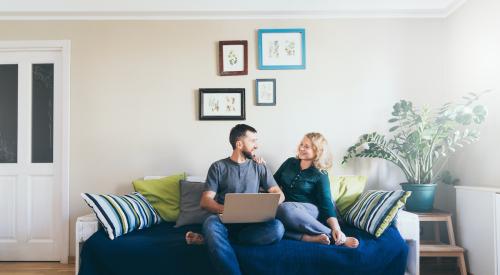 Couple smiling on the couch