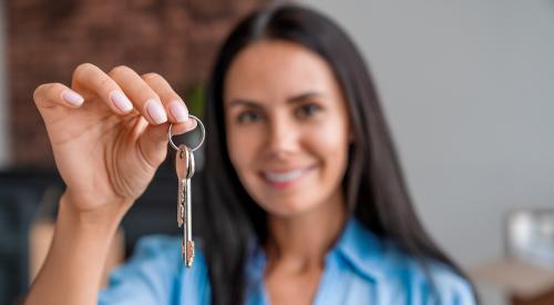 woman holding house key