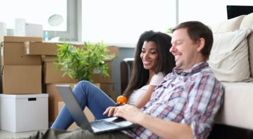 Couple looking at laptop