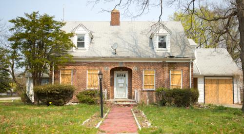 Boarded up old house ripe for a buyer and renovation