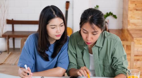 Couple looks over paperwork together