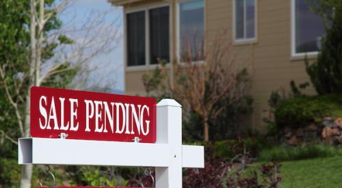 For sale home sign topped with sale pending sign