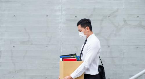 Man in mask walking sad out of lost job