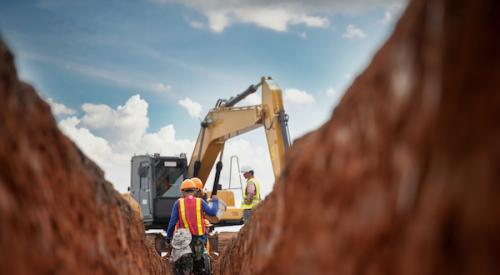 Construction workers preparing site for pouring foundation