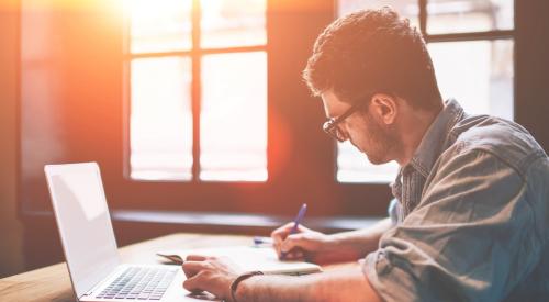 man studying on laptop