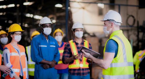 Group of masked construction workers