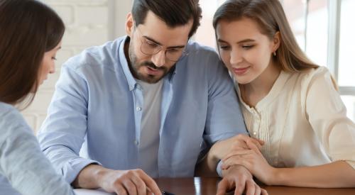 Young couple buying a house