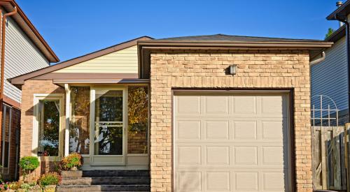 This photo shows just a house with a one-car garage.