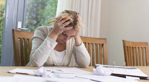 Upset woman with paperwork