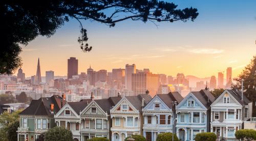 Row of San Francisco homes with downtown behind