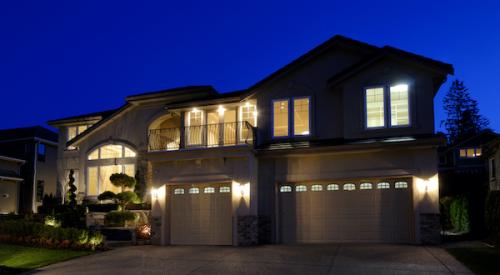 House at night with lights on using energy