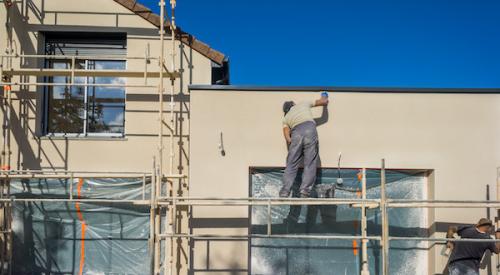 New home exterior being painted