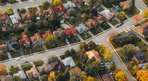 Aerial view of houses in residential community in autumn