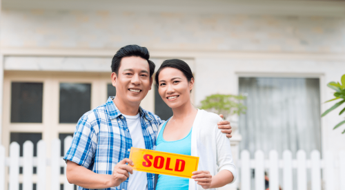 Asian couple who have just bought a new home