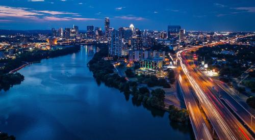 Austin, TX skyline and freeway at dusk 