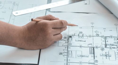 Marking up build-to-rent floor plans with a pencil