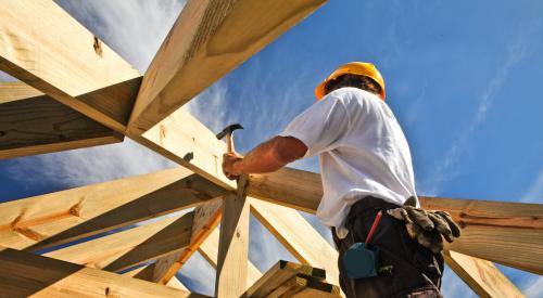 Carpenter framing a house