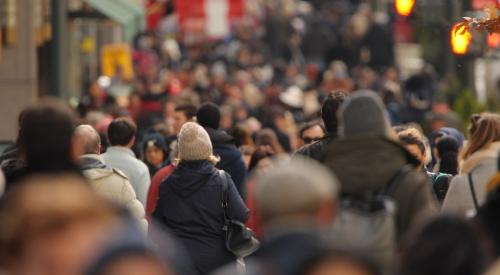 Crowd of people walking in city