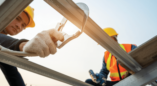 Framing crew using anchors and harnesses for fall protection 