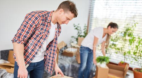 Couple unpacking boxes